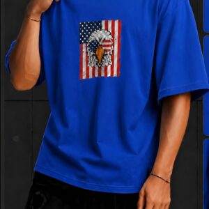 Home Blue oversized T-shirt featuring a bold American eagle and flag graphic on the front, worn with black pants.