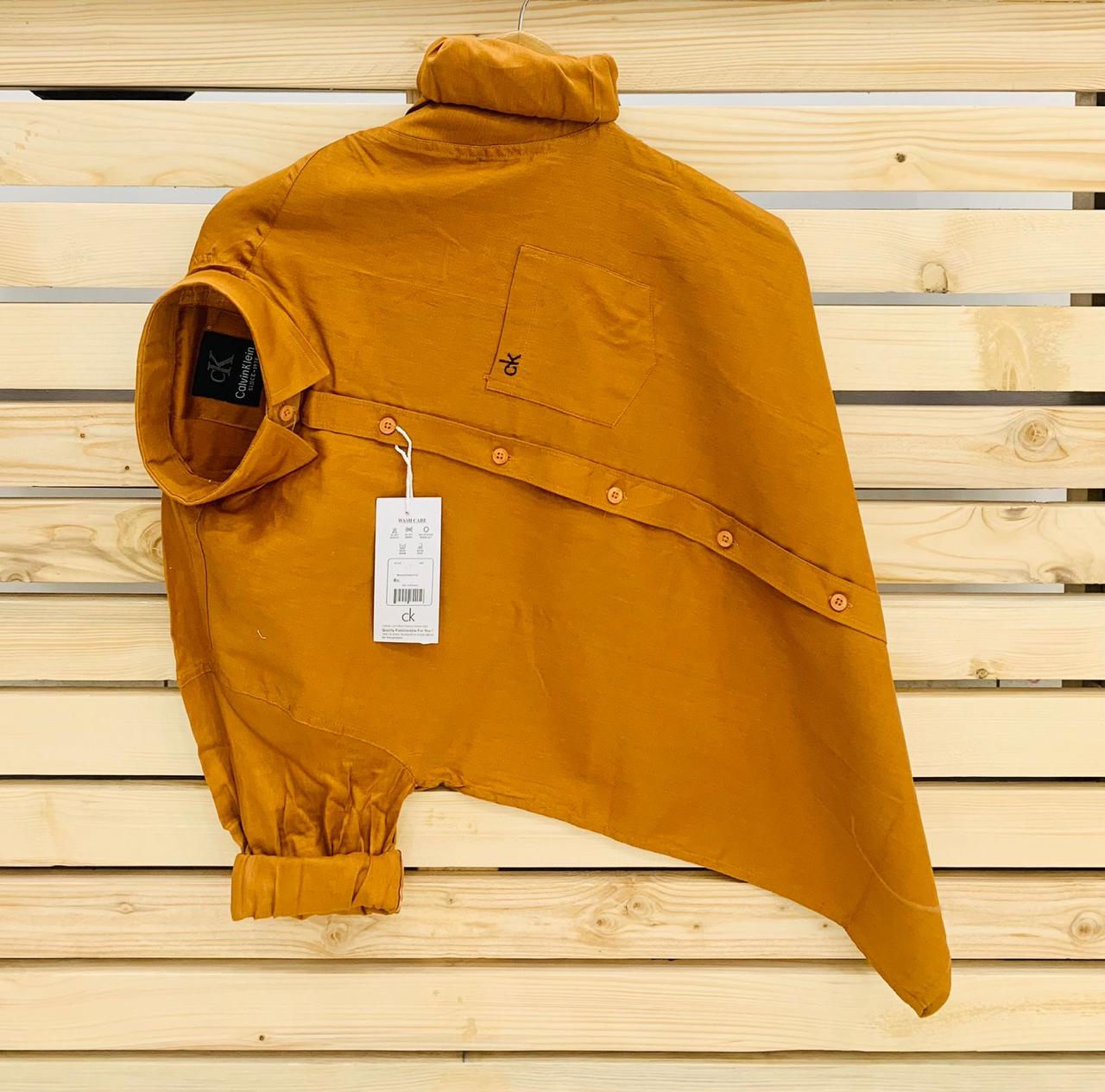Calvin Kevin Plain Shirt – Mustard Calvin Kevin mustard yellow plain men's shirt with hard collar, full sleeves and embroidered logo.