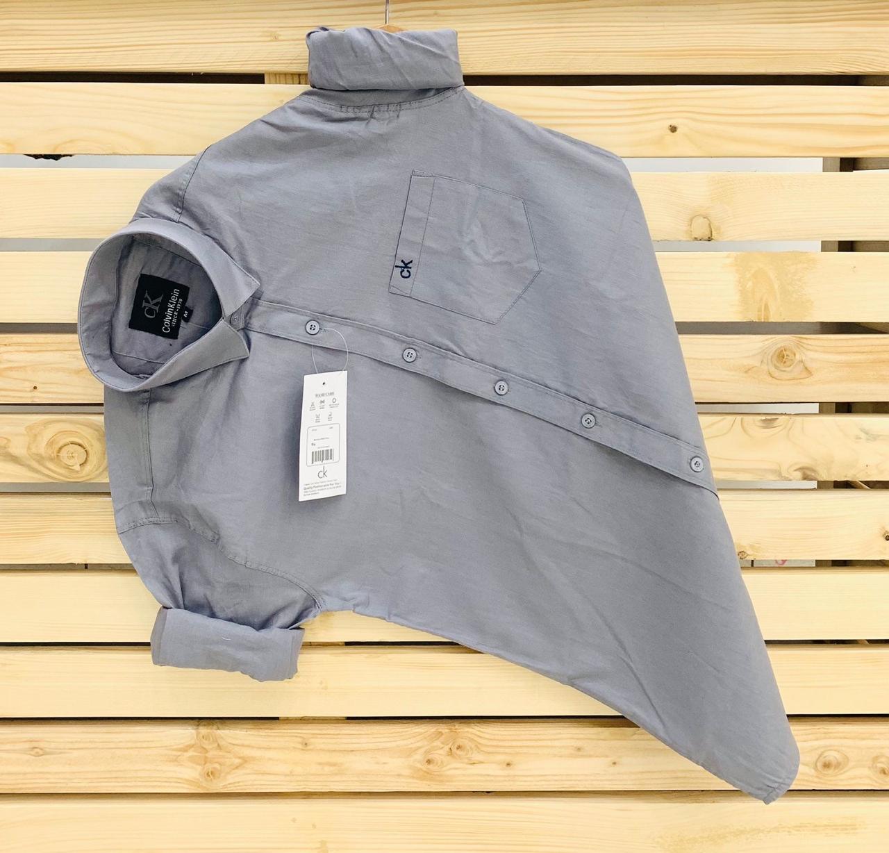 Calvin Kevin Plain Shirt – Grey Calvin Kevin grey plain men's shirt with hard collar, full sleeves and embroidered logo.