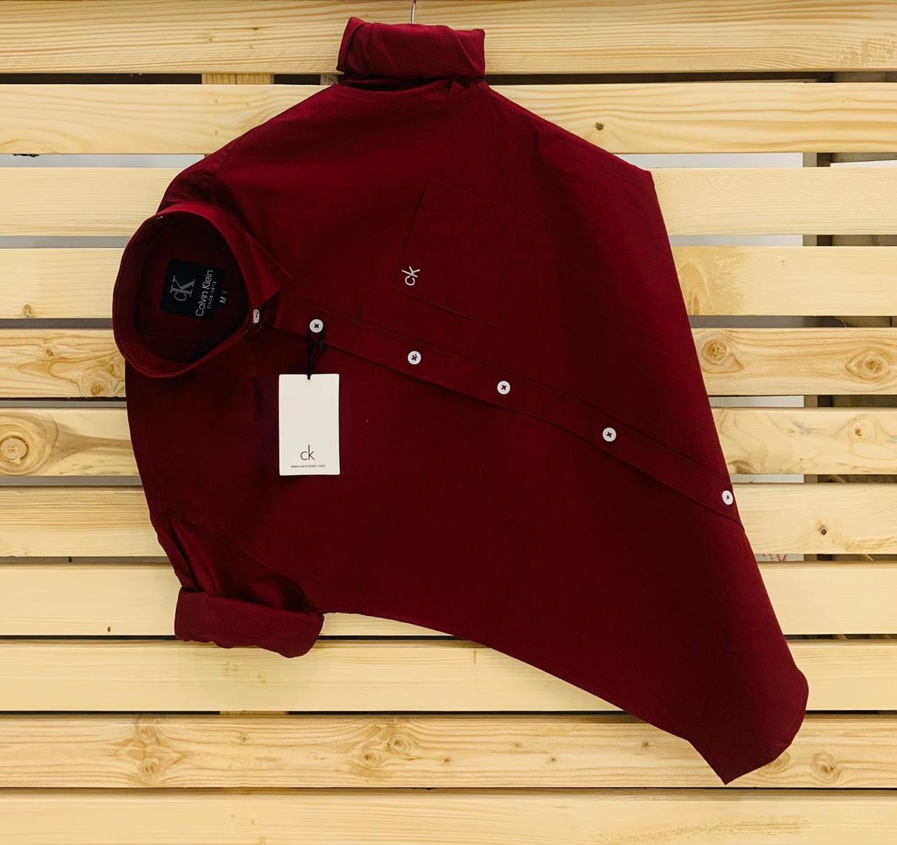Calvin Kevin Plain Shirt – Maroon Calvin Kevin maroon plain men's shirt with hard collar, full sleeves and embroidered logo.