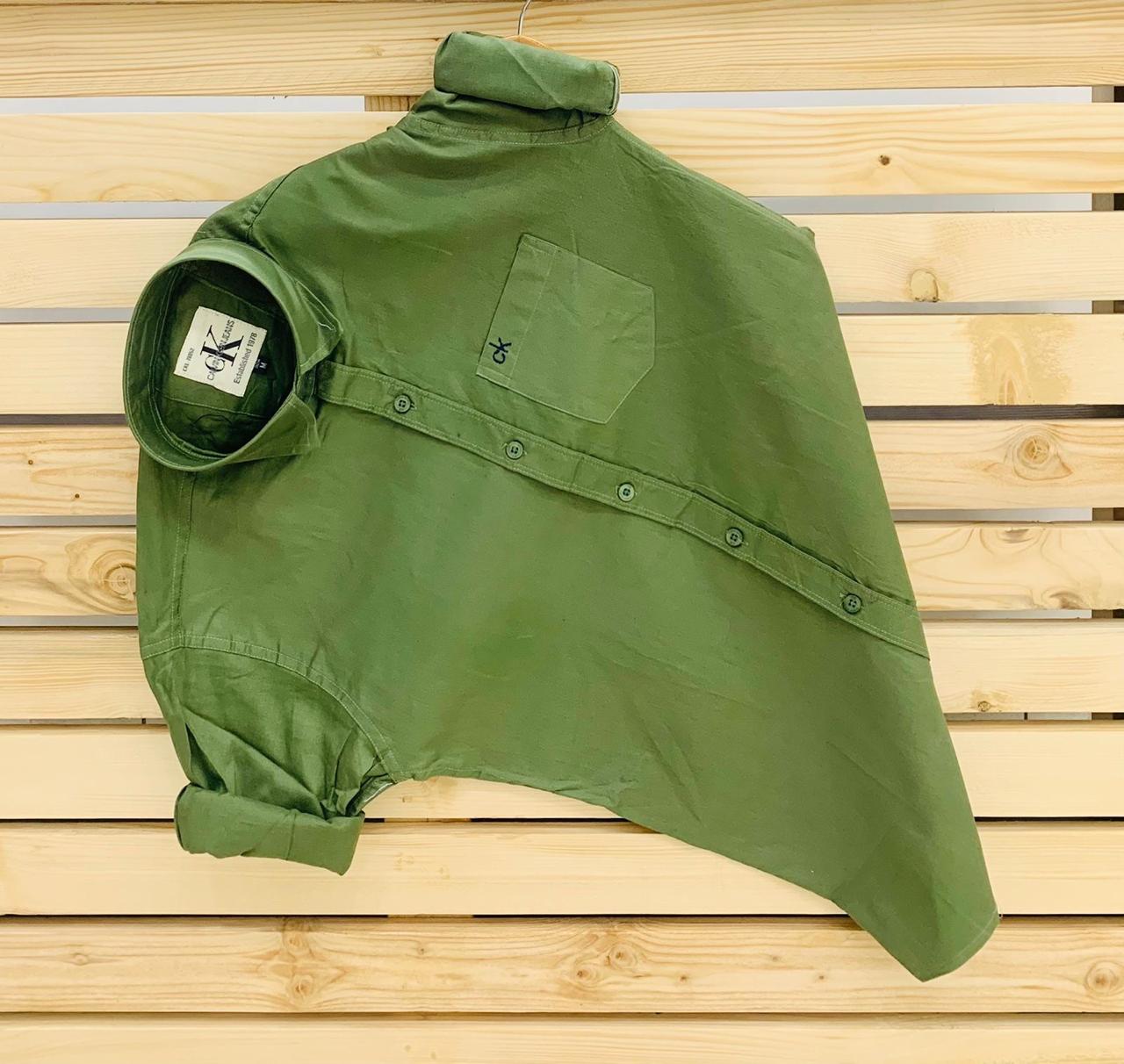 Calvin Kevin Plain Shirt – Olive Green Calvin Kevin olive green plain men's shirt with hard collar, full sleeves and embroidered logo.