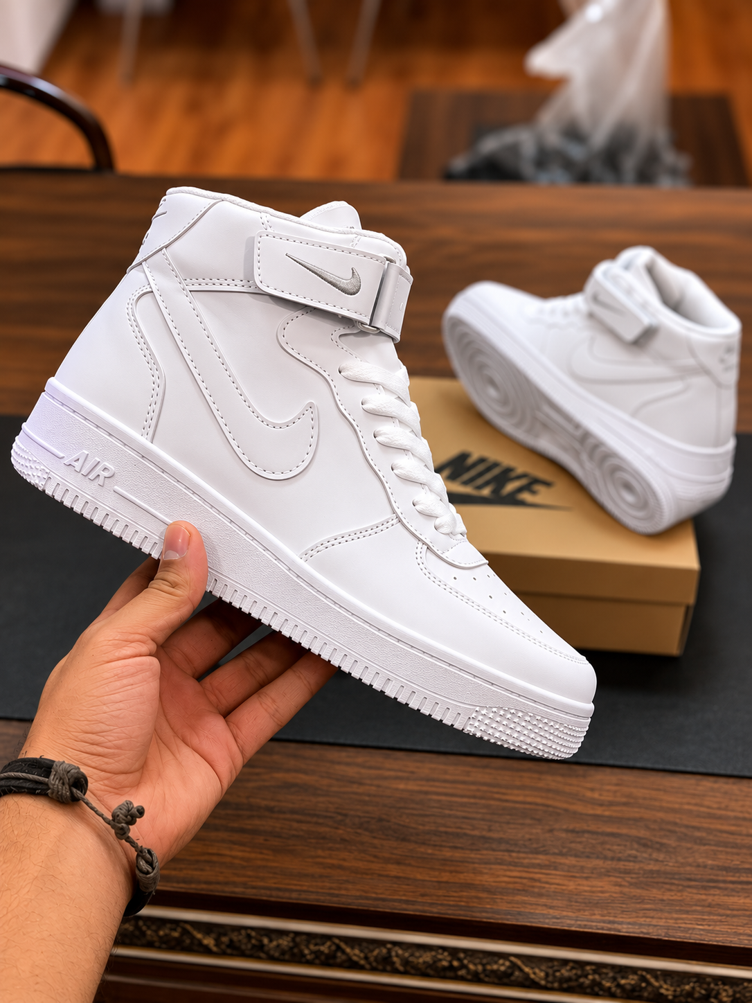 Classic White High-Top Sneaker White high-top sneaker with tonal detailing and ankle strap