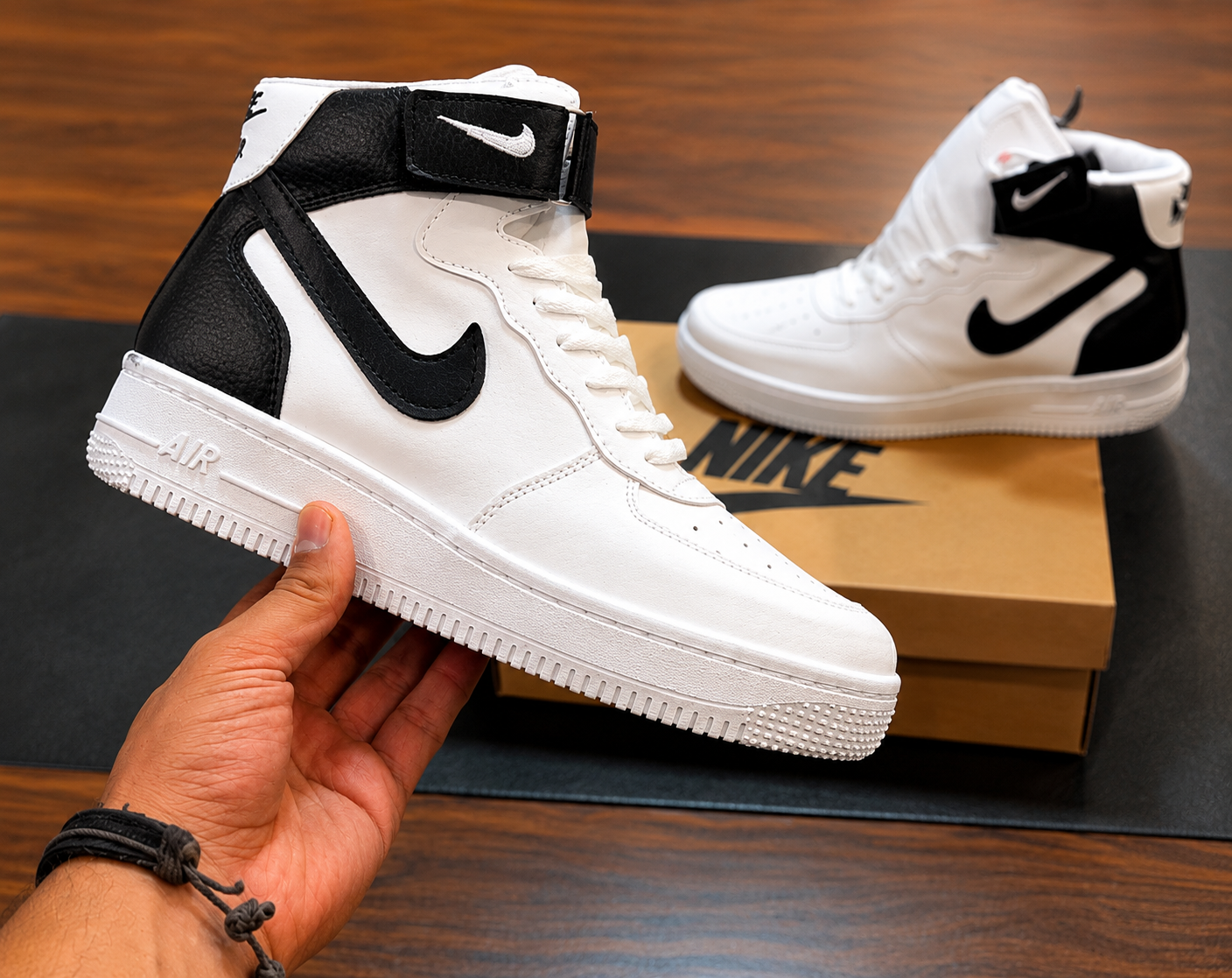 White Black High-Top Sneaker Front View White and black high-top sneaker with ankle strap and textured sole