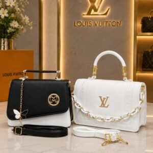 Black and white handbags with gold chain straps and gold hardware