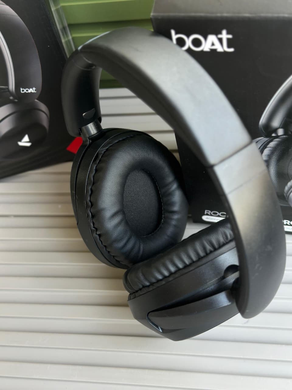 boAt Rockerz 650 Pro Wireless Headphones boAt Rockerz 650 Pro black wireless over-ear headphones displayed on a minimalist stone pedestal