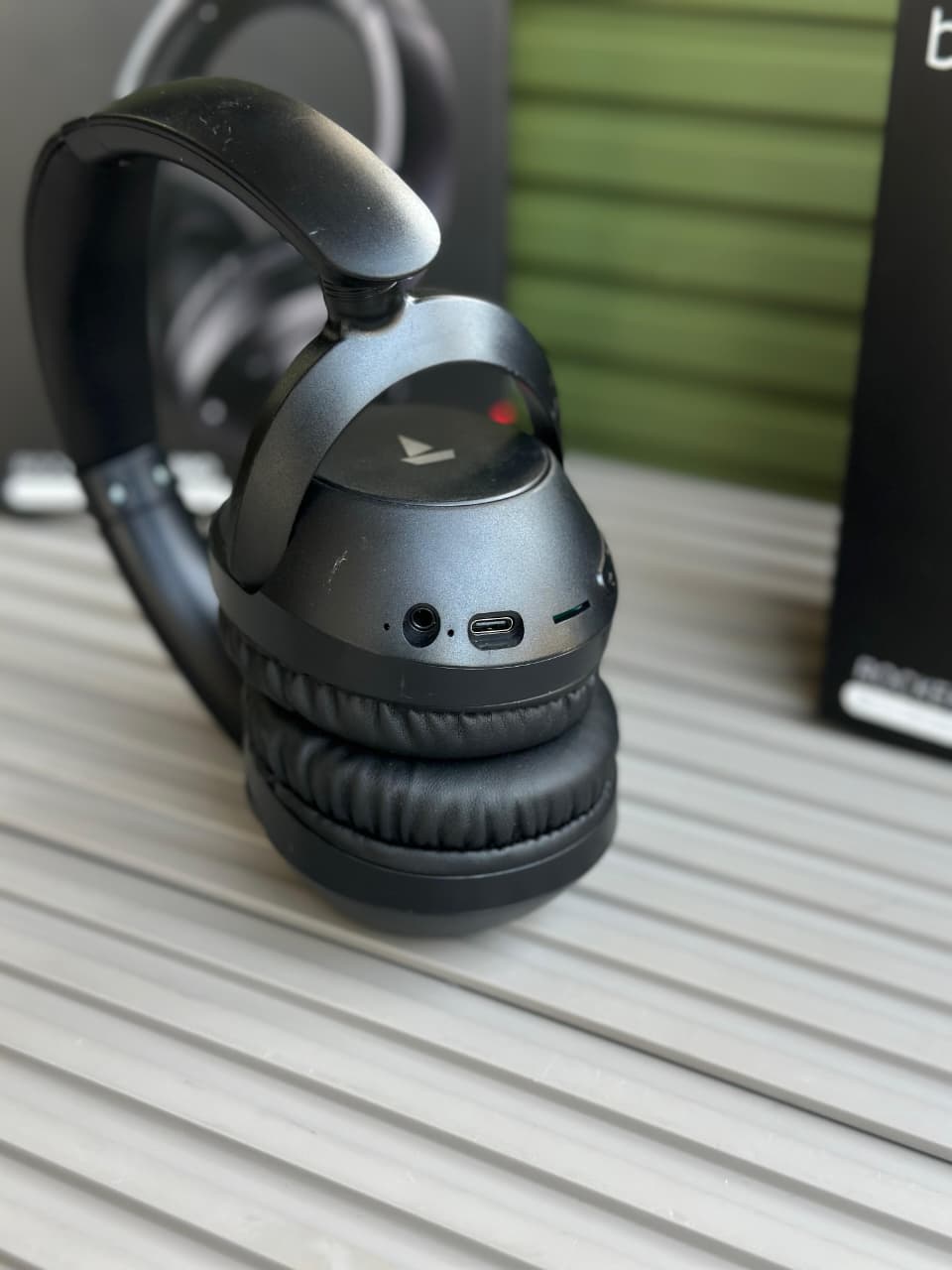 boAt Rockerz 650 Pro Wireless Headphones boAt Rockerz 650 Pro black wireless over-ear headphones displayed on a minimalist stone pedestal