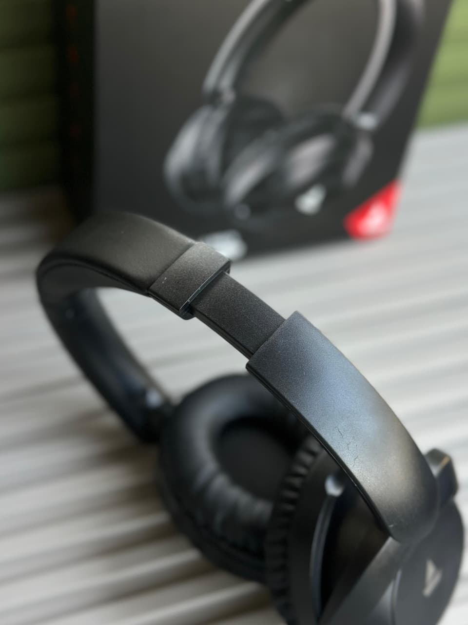 boAt Rockerz 650 Pro Wireless Headphones boAt Rockerz 650 Pro black wireless over-ear headphones displayed on a minimalist stone pedestal