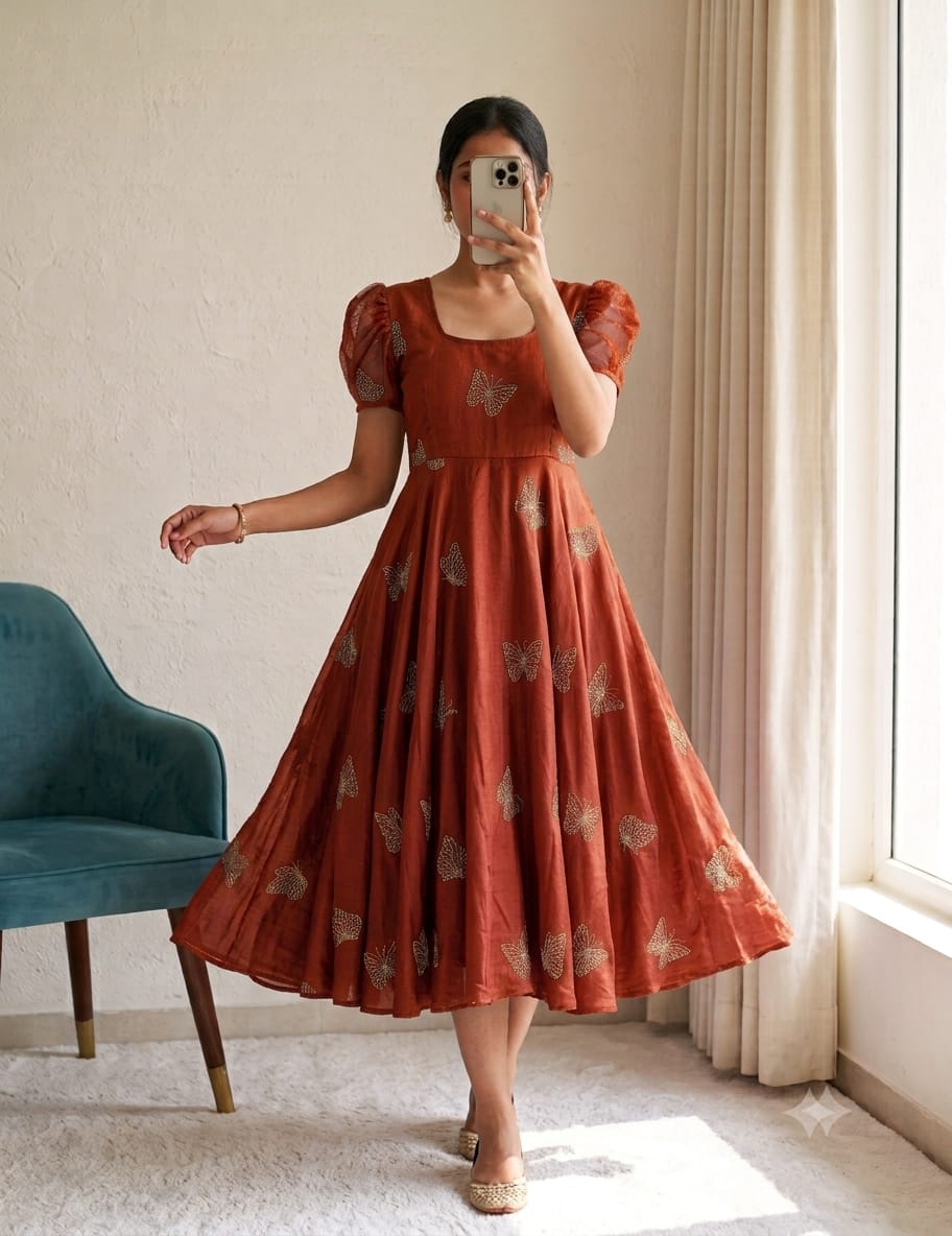 Rust Orange Rangoli Silk Designer Gown Rust orange Rangoli Silk gown with beads and sequin work